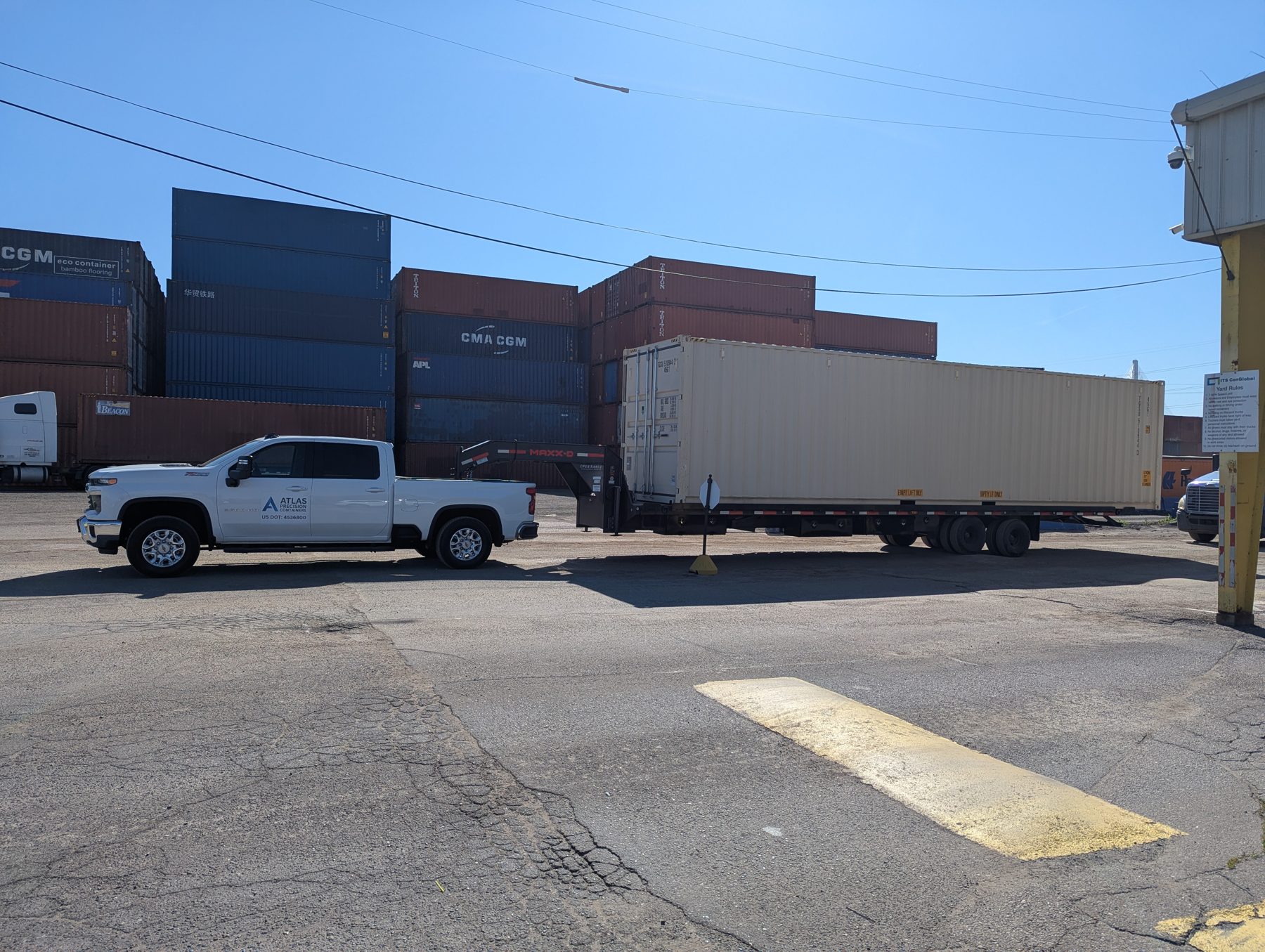 Atlas Precision Containers truck delivering a container