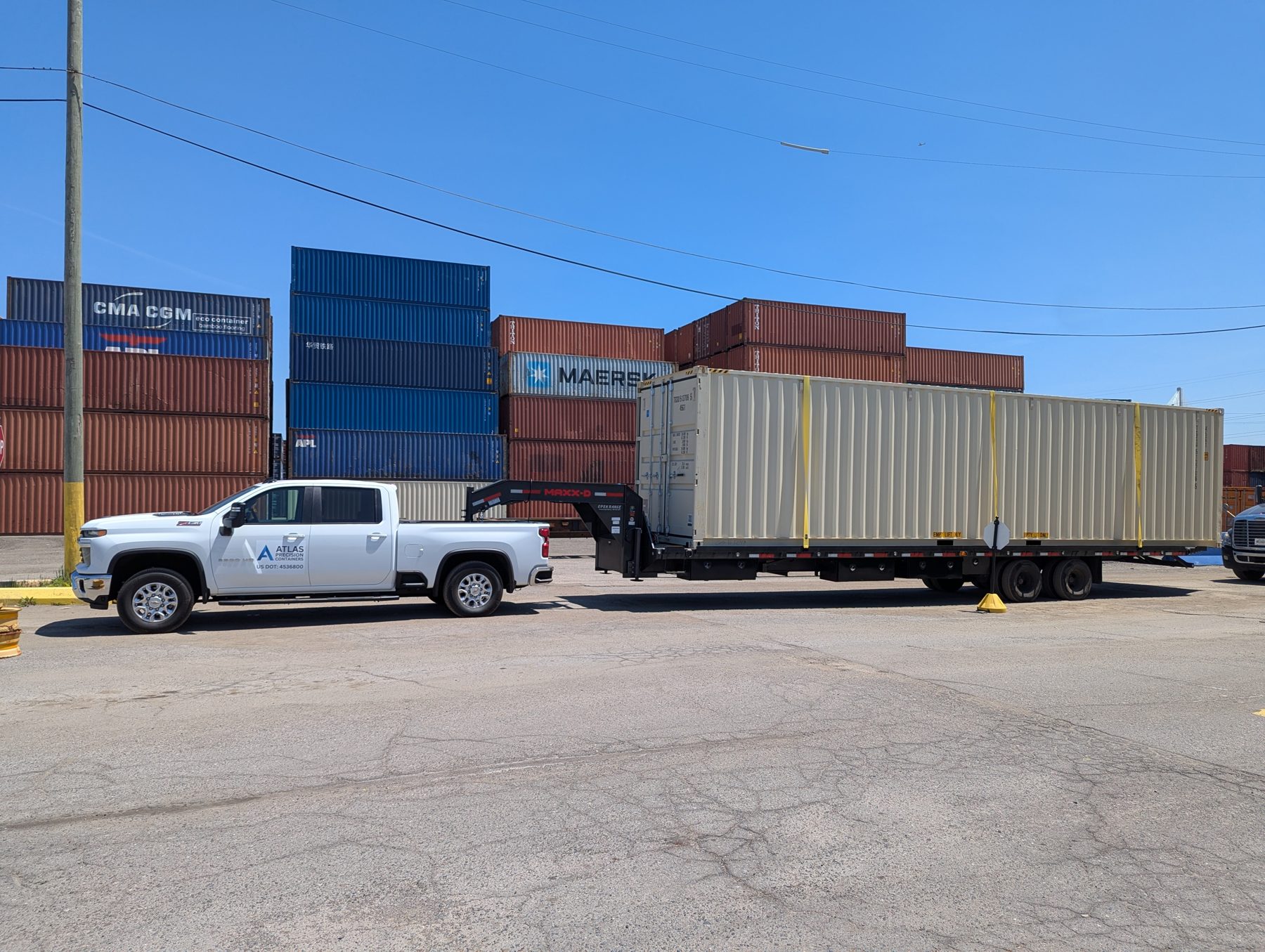 Atlas Precision Containers truck at a container depot